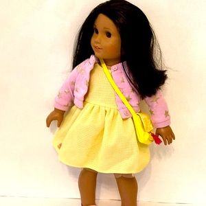 Yellow dress, yellow purse, and a purple sweater OG doll/ American girl doll